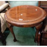 A 60cm diameter polished oak occasional table with incised decoration and pad feet