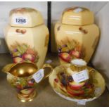 A pair of Aynsley ginger jars and covers with transfer printed fruit decoration - sold with a