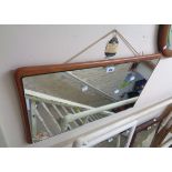 A vintage teak backed oblong wall mirror with applied plate - from a dressing table