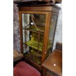 A 60cm Edwardian mahogany and strung display cabinet with material lined interior, set on square