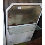 A vintage Art Deco style bathroom splashback with chrome fittings and glass shelf on an opaque white