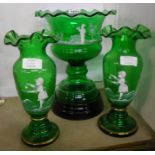 A late 19th Century Mary Gregory style green glass garniture set comprising pedestal bowl on black