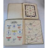 Two scrap books containing collections of heraldic embossed stamps and others, many within