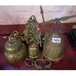 Two large cast brass porch bells with decorative brackets - sold with a smaller similar