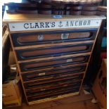 A 38cm oak and mixed wood haberdashery unit, branded Clark's Anchor, with a flight of seven fitted