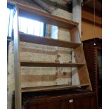 An 86cm stripped pine wall mounted three shelf open bookcase