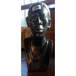 An African carved stone bust of a man