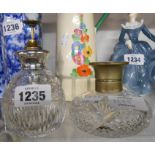 A 1920's silver and enamel topped cut glass spray action perfume bottle - sold with a similar silver