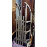 A vintage wood and wrought iron sled - a/f