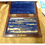 A harlequin set of draughtsman's drawing instruments in rosewood case