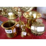 Five pieces of vintage and antique brassware comprising three bells, a mortar and Eastern pot