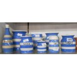 Eight pieces of TG Green Cornishware comprising sauce bottle and stopper, soda storage jar, sultanas