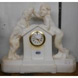 A vintage plaster cased timepiece with boy, dog and Take It Slowly text, with simple mechanical