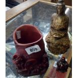 An Oriental plaster Buddha figurine - sold with a resin koi carp vase and small resin Buddha