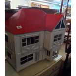 A large vintage dolls house and contents