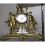 A 1920's cast brass timepiece with flanking male and female figures to dial with engine turned