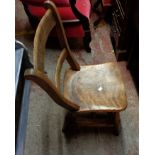 An antique stained wood kitchen chair with moulded solid seat, set on ring turned supports