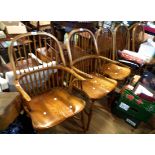 A set of six reproduction Windsor hoop stick back chairs with thick moulded solid elm seats, set