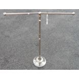 A chrome plated T-bar stand