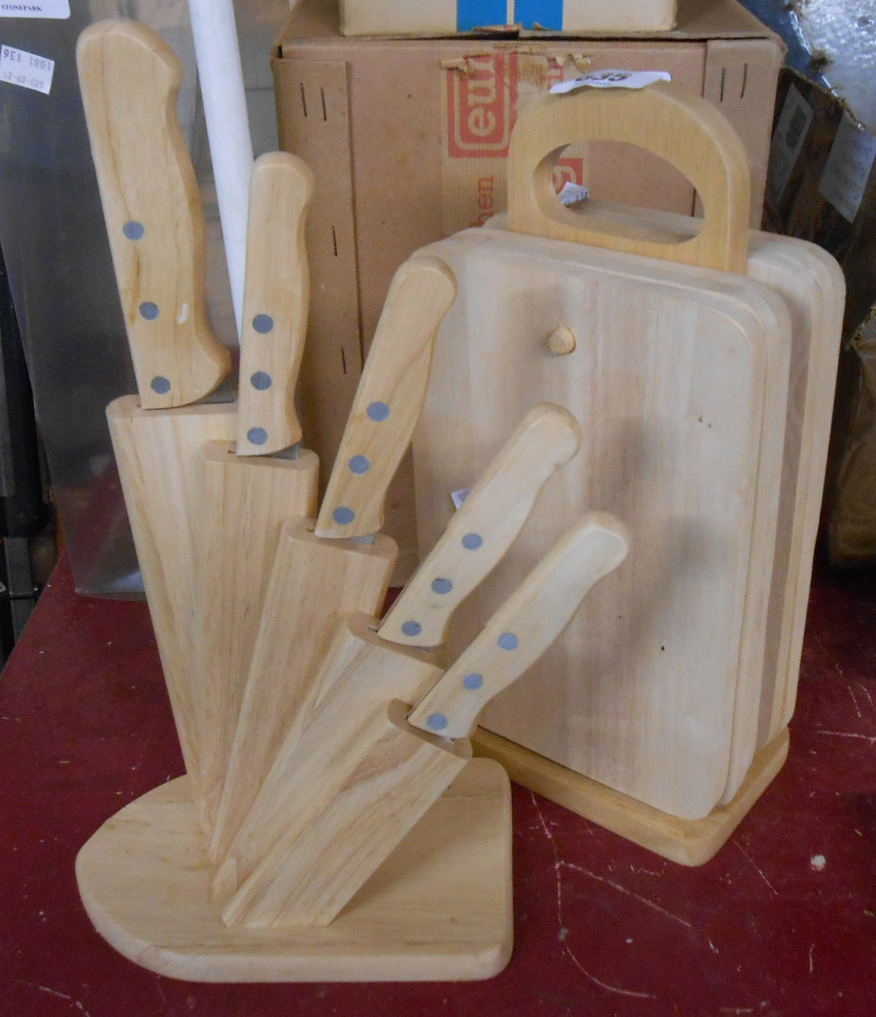 A modern pine kitchen knife block - sold with a set of wooden chopping boards and stand