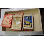 A tray containing an assortment of vintage card games including Disney Wu-Pee, pantomime snap,