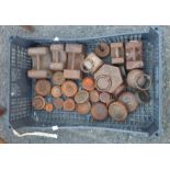 A crate containing a quantity of old cast iron weights