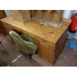 A 1.51m modern pine kneehole desk with short drawers, flanking file drawer and cupboard
