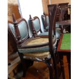 A set of five mahogany framed panel back dining chairs, set on front scroll cabriole legs - for