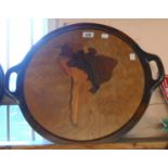 A vintage tray inlaid with a map of continental South America with different woods representing