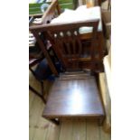 A pair of antique oak framed standard chairs with solid seat panels - sold with an upholstered