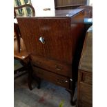 A 70cm 1920's mahogany and stained wood tallboy with double cupboard over two long graduated