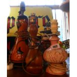 Four assorted table lamps comprising French pottery, converted Victorian glass oil lamp, turned wood