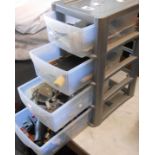 A plastic crate of drawers containing jewellery and watch repair equipment