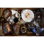 A box containing assorted ceramic items including a set of Staffordshire copper lustre graduated