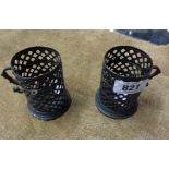 Two antique brass cage form candle holders