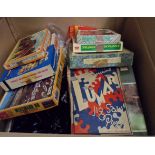A box containing a large quantity of vintage jigsaw puzzles including GWR, Rupert Bear, etc.