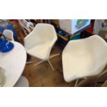 A set of four vintage moulded white plastic elbow chairs designed by Robin Day for Hille, set on