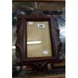 A carved mahogany picture frame with decorative scroll border - initial HGF 1910 to back
