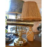 A modern brass banker's style table lamp - sold with a vintage raffia covered bottle with matching