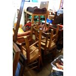 A set of four old stained beech framed standard chairs with rush seats, set on square supports -
