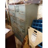A 96cm 1960's RAF grey painted metal filing unit with four flights of five drawers, set on plinth