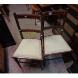 Two Edwardian mahogany and strung bedroom chairs with upholstered seats