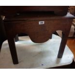 A 19th Century mahogany commode with liner and shaped apron, set on chamfered square legs