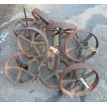 Eight old cast iron chicken coop wheels