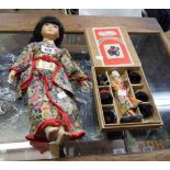 A 20th Century Japanese porcelain doll in decorative traditional dress - sold with a boxed Hanako