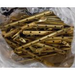 A large quantity of cast brass window latch fittings, etc.