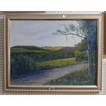 A framed vintage on board, depicting a rural track in landscape