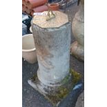 A concrete pedestal with brass sundial top