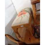 A 20th Century oak dressing stool with signed and dated hand worked poppy decoration to drop-in