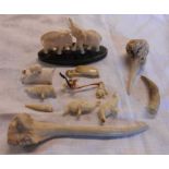 A bag containing a quantity of carved bone, horn, celluloid and other items including Japanese